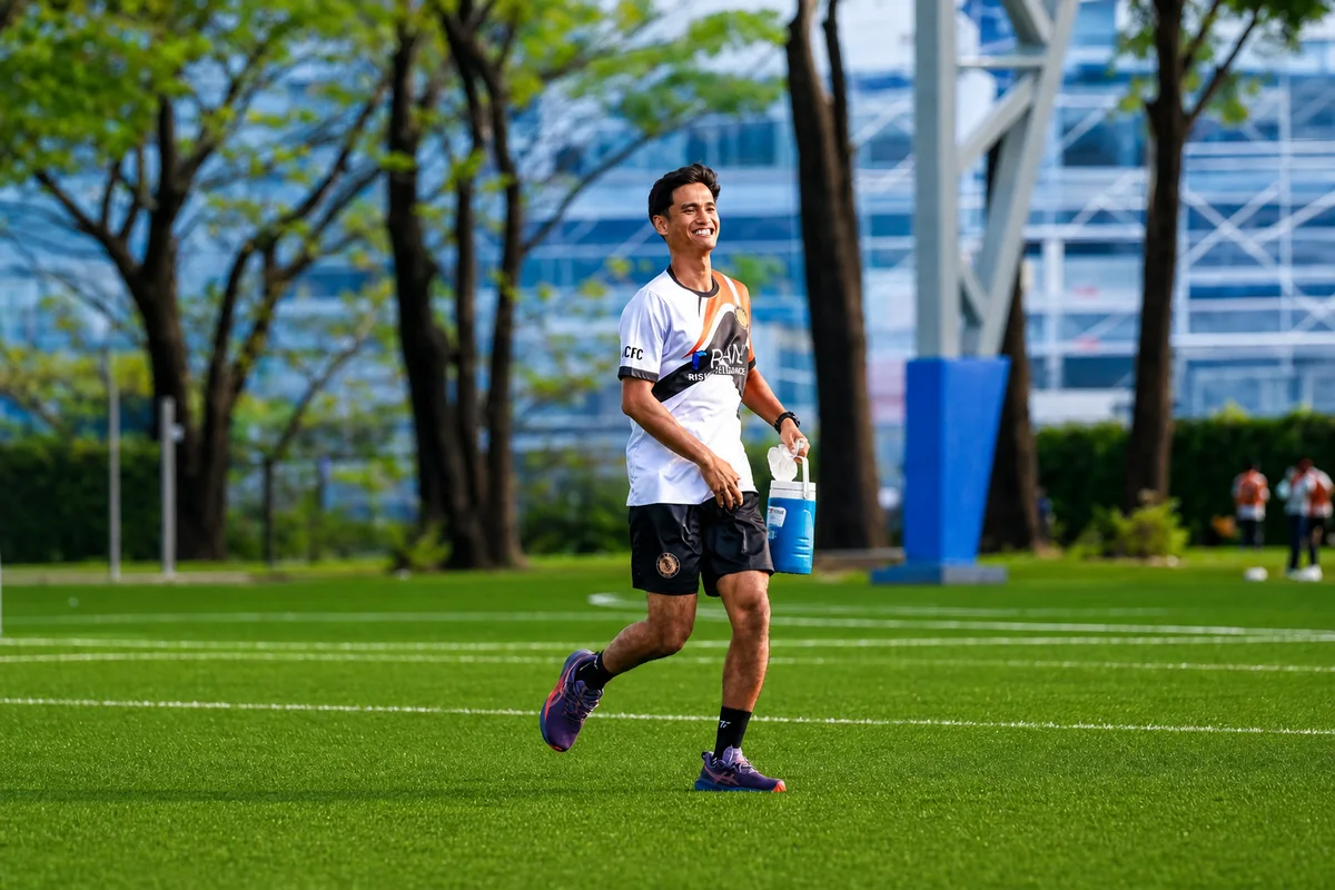 Coach Indra Putra on a football pitch