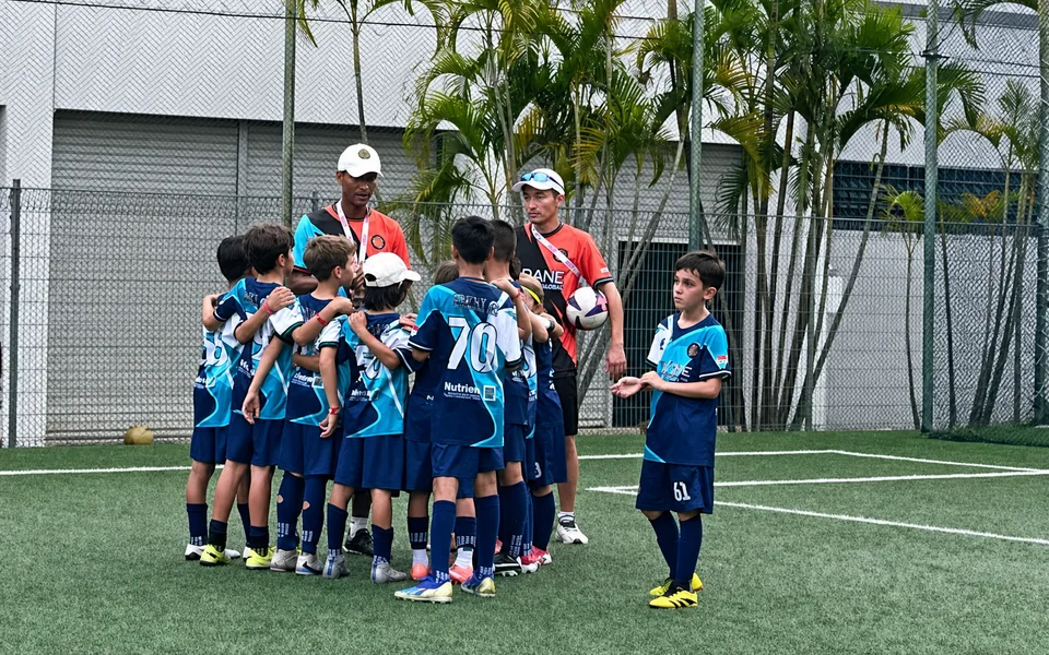 Island City footballers competing during a match